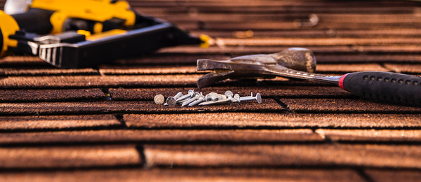 Roof with hammer and nails.