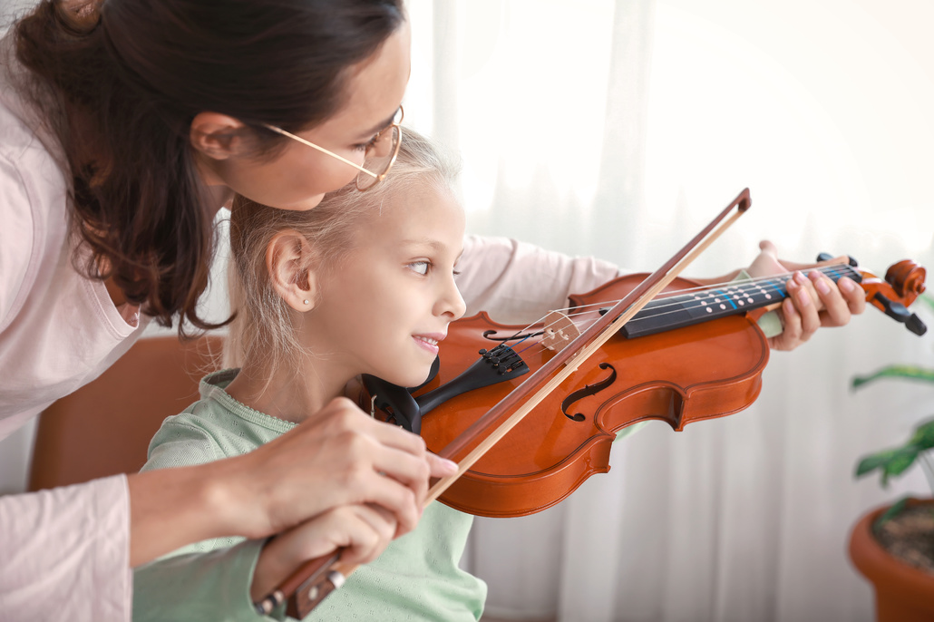 Learning to play the violin.