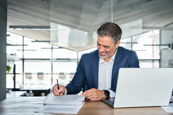 Businessman writing about sustainable compliance