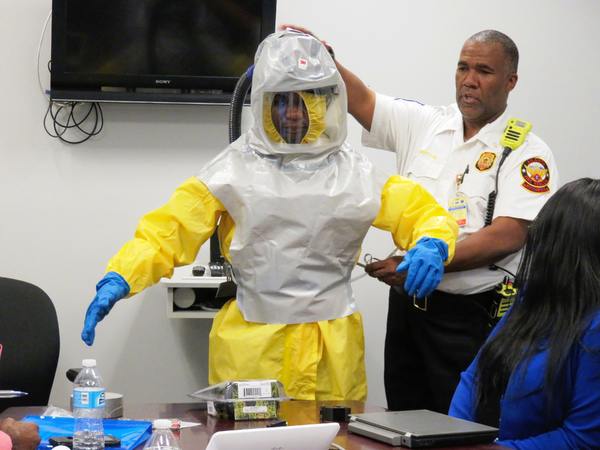 Man in a safety suit.
